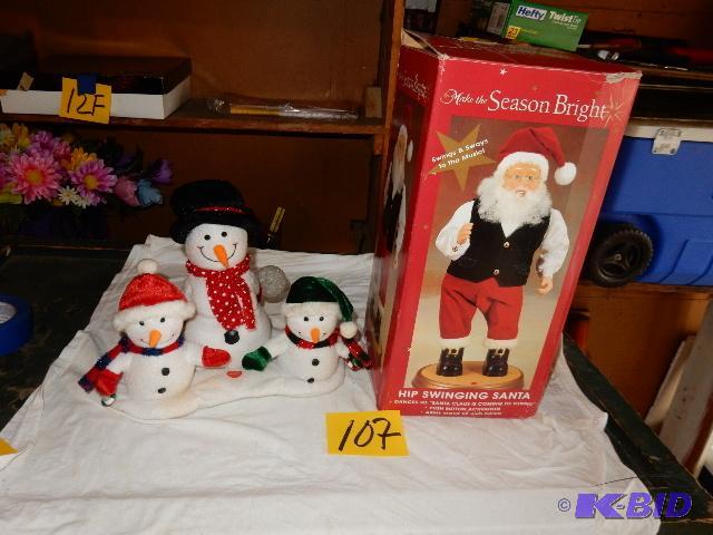 lot 107 image: Hip Swing Santa (works) 3 Snow men statues.. ...