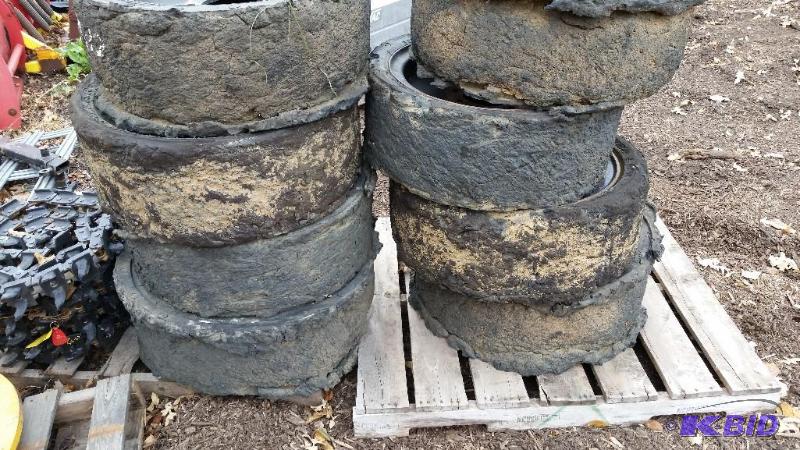 lot 26 image: Used bobcat skidsteer loader tires.  This auction is for (4) tires.  You pick the best 4 tires.
