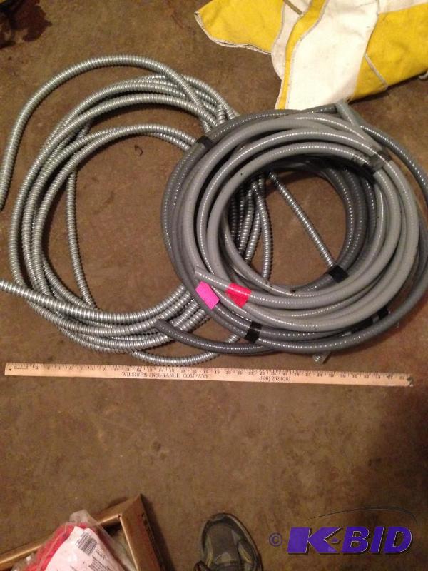 lot 13 image: Elect. Flex 5 plastic roll 1 metal roll...