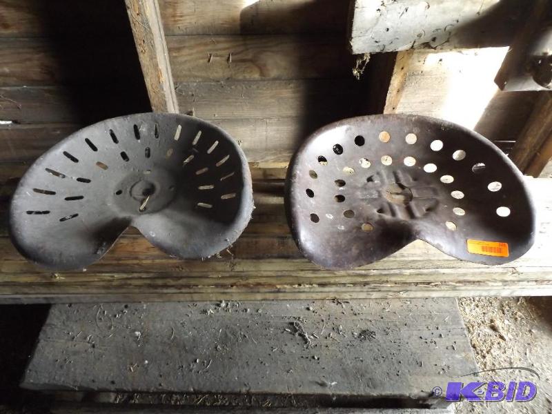two antique tractormachinery seats...