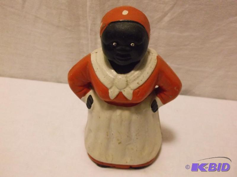 lot 12 image: Heavy cast iron Aunt Jemima coin bank measuri...