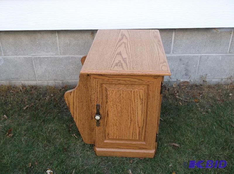 lot 33 image: End table with magazine rack measuring 14&quo...