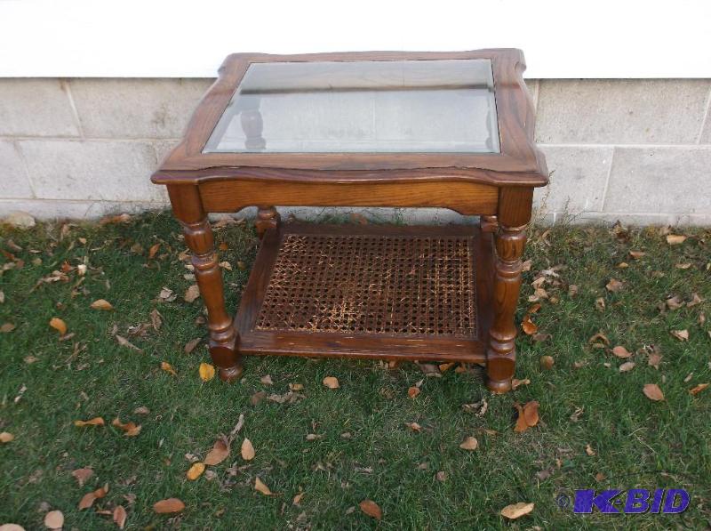 lot 9 image: Oak end table with beveled glass measuring 22...