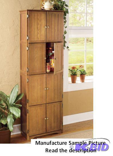 lot 63 image: Oak Finish Eight Door Pantry Cabinet - Four c...
