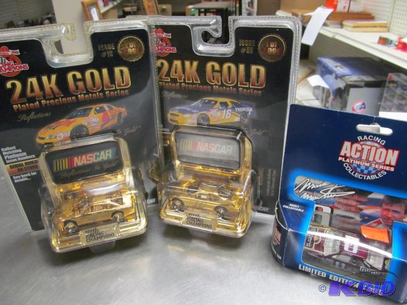 lot 128 image: Lot of 3 Racing Champions 24 k Gold & Action 164 Die Cast Cars
