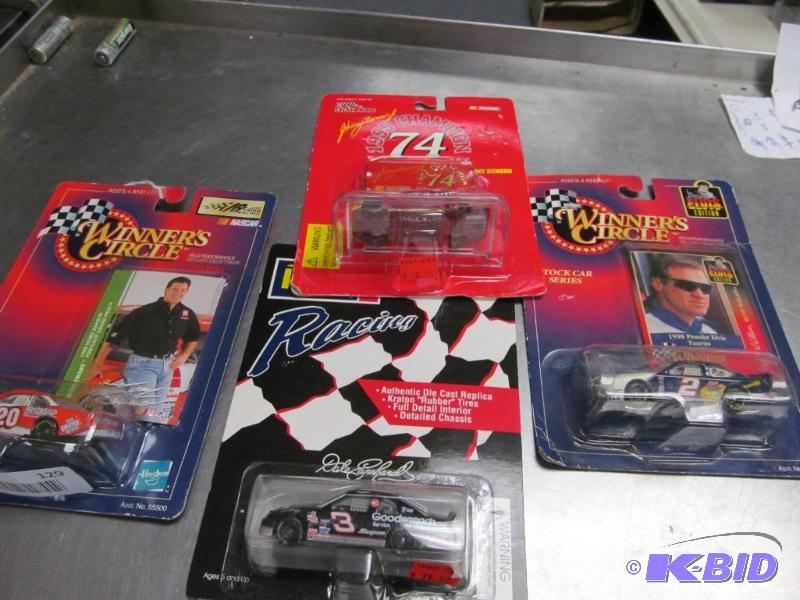 lot 129 image: Lot of 4 Racing Champions, Revell & Winners Circle164 Die Cast Cars