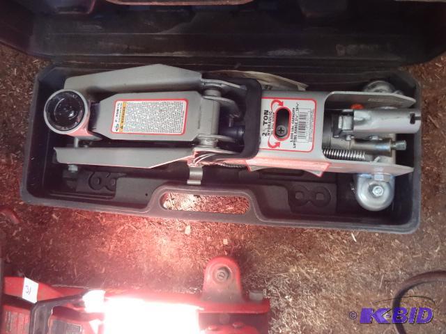 lot 30 image: Mack 2 12 ton trolley Jack. No handle...