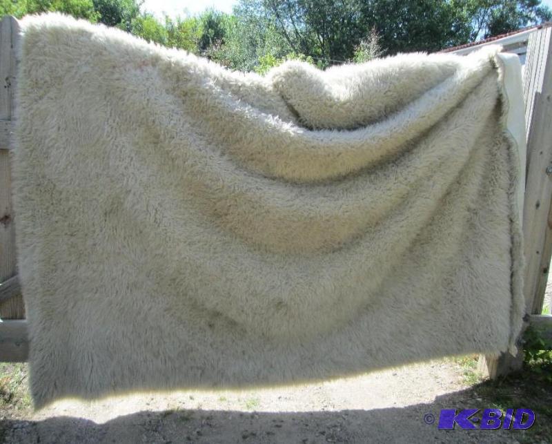 lot 163 image: white fluffy 10 12 ft. x 8 12 ft. rug...
