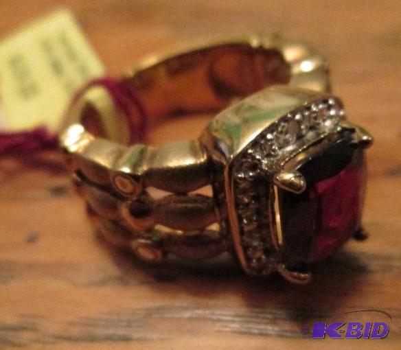 lot 34 image: Two tone 14k gold plated ring with purple sto...