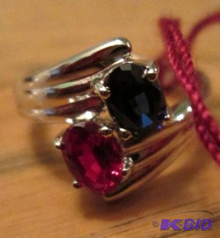 lot 42 image: Red and blue crystals in silver colored band...