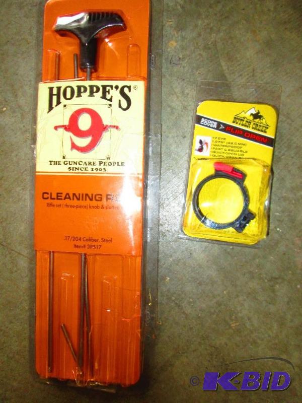 lot 5 image: Gun cleaning rod and scope cover...