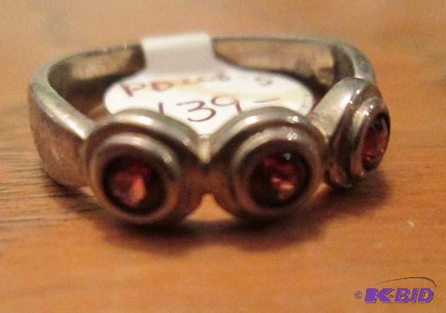 lot 57 image: Garnet and sterling silver ring...