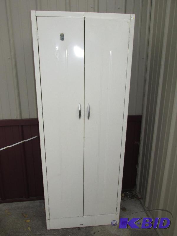 lot 16 image: Tall Metal Cupboard