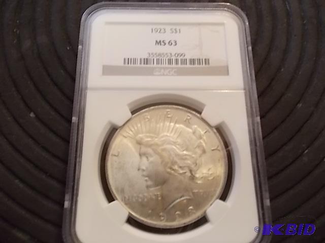 lot 23 image: 1923 Silver Peace Dollar Graded MS 63...