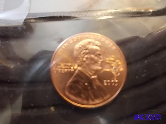 lot 54 image: Lincoln Penny With MN Vikings Re-Strike Novel...