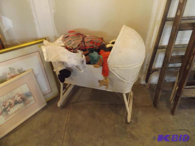lot 45 image: Bassinet with stuffed bears and toys...