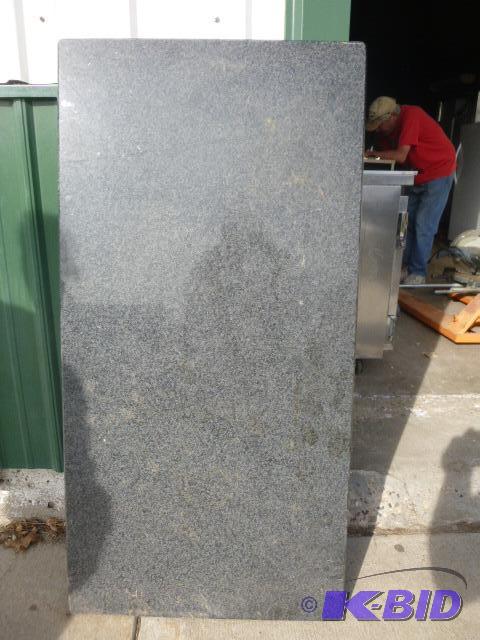 lot 194 image: Granite Count Top Approximately 48" X 24...
