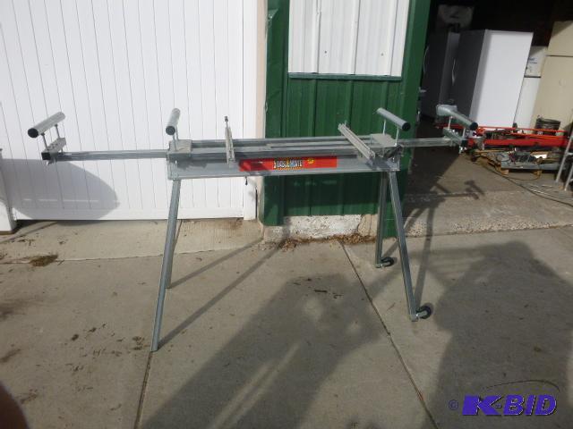 lot 199 image: Stable Mate Miter Saw Stand Folds up....