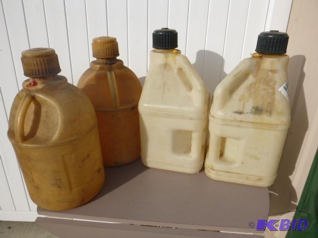 lot 209 image: Four Racing Fuel Jugs...