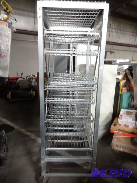 lot 18 image: Metal rack on wheels. 8 adjustable trays. 26 ...