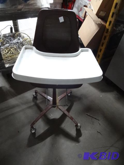 lot 27 image: Kids high chair on wheels...