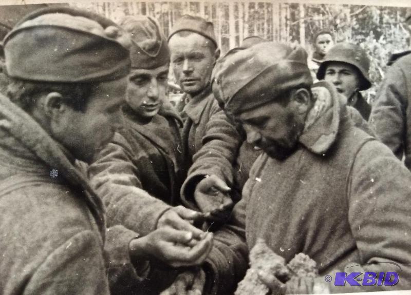 Starving German or US Troops receiving ration of bread 1943
