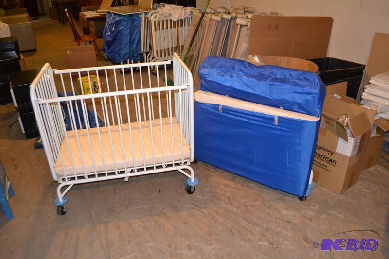 lot 50 image: LA Baby Foldable metal crib on wheels with ma...