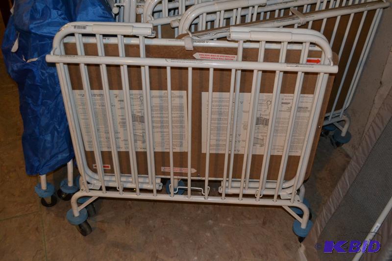lot 55 image: LA Baby Foldable metal crib on wheels with no...