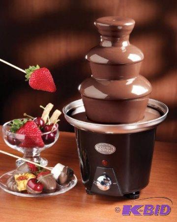 lot 27 image: Nostalgia Electrics CFF965 Mini Chocolate Fondue Fountain