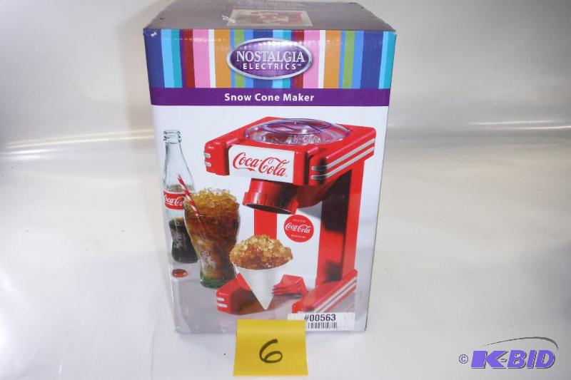 lot 6 image: Nostalgia Electrics Coca Cola Series RSM702COKE Single Snow Cone Maker