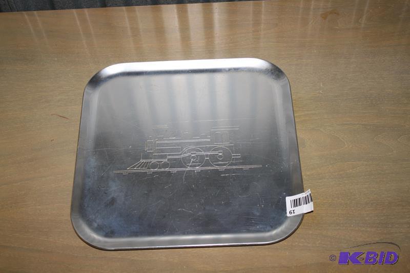 lot 19 image: Aluminum Tray with a vintage train etched int...