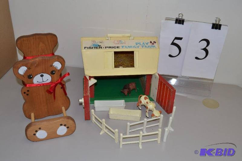 lot 53 image: Fisher Price Play Family Farm and teddy bear book rack