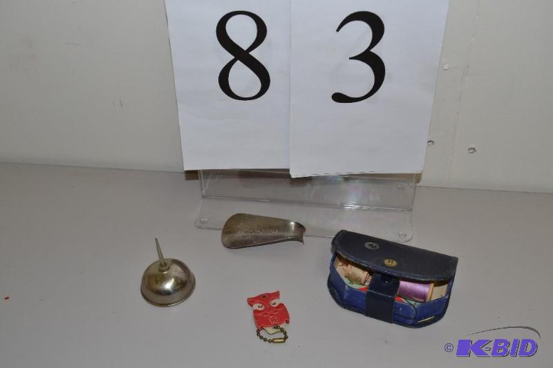 lot 83 image: Shoe horn, sewing kit, oil can & key chain