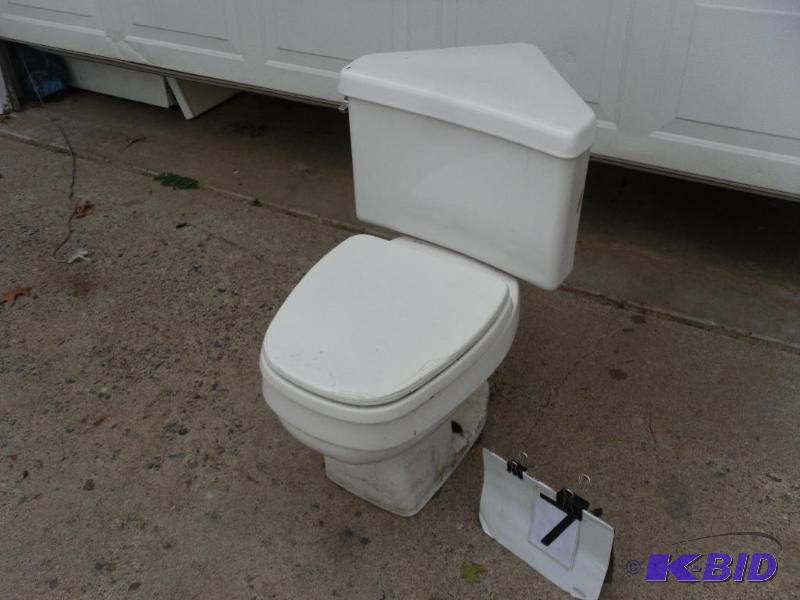 lot 122 image: Corner Toilet. Needs cleaning. Could benefit ...