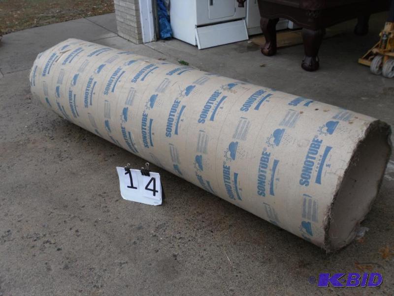 lot 84 image: Round Sonotube. Measures approximately 8 ft l...