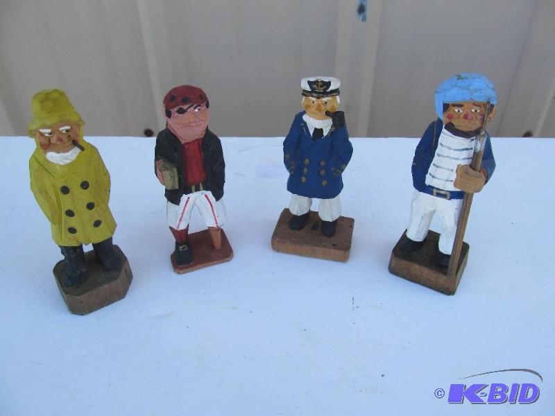 lot 23 image: Hand-carved nautical figurines....
