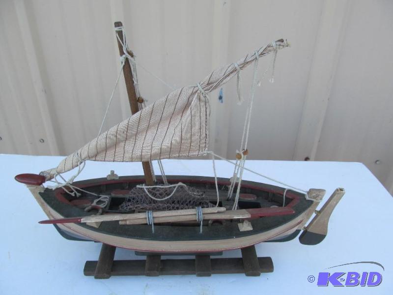 lot 24 image: Hand-carved fishingsailing boat...nice....