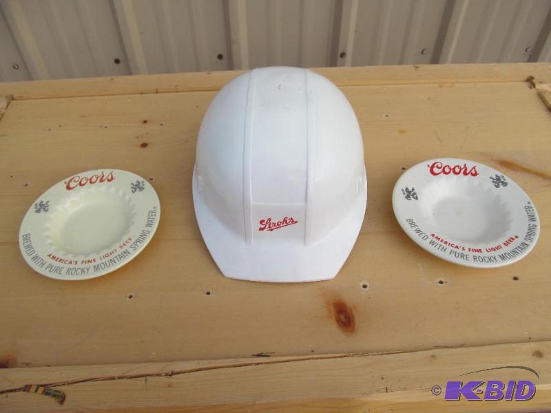 lot 70 image: Coors ash trays and&nbspSchlitz helmet....