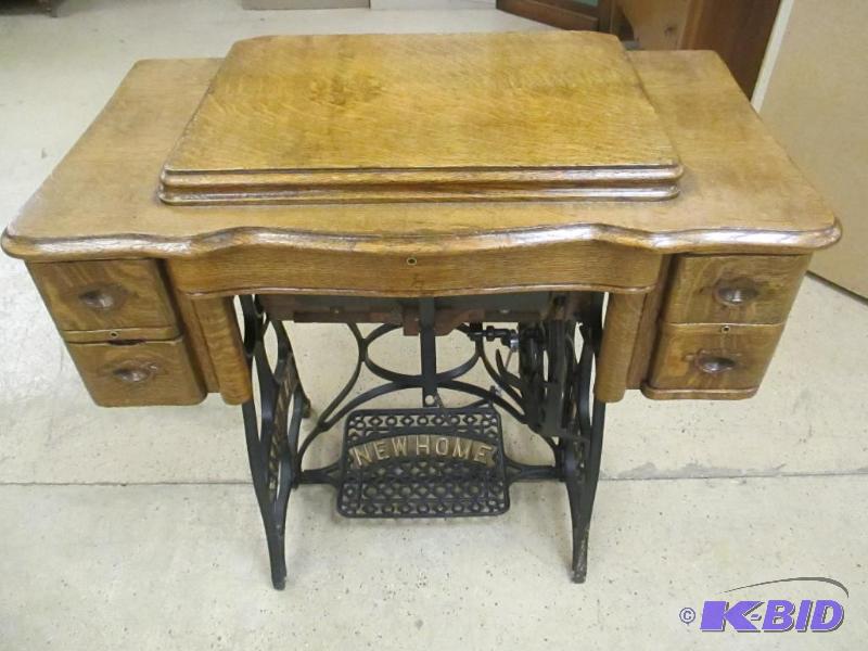 lot 22 image: Antique Ornate New Home Treadle Sewing Machine