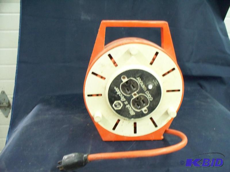 lot 63 image: Black  Decker extension cord and winder...