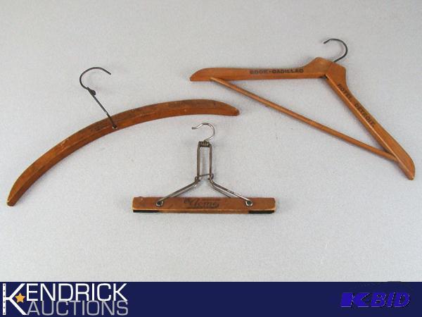 lot 11 image: Lot of 3 Antique Advertising Wooden Hangers