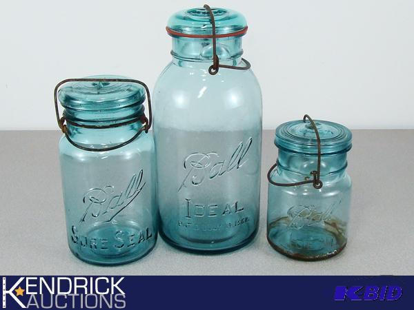 lot 140 image: Antique Covered Blue Mason Jars