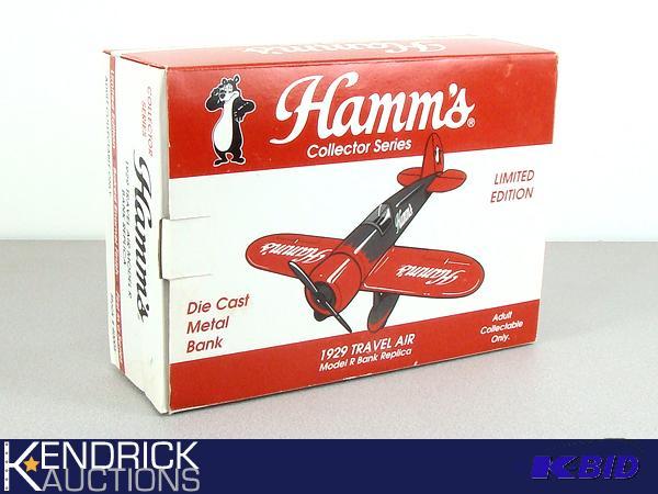 lot 19 image: Mint in Box Hamms Beer Metal Airplane Bank