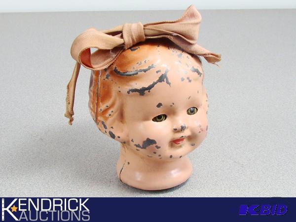 lot 75 image: Antique Metal Doll Head