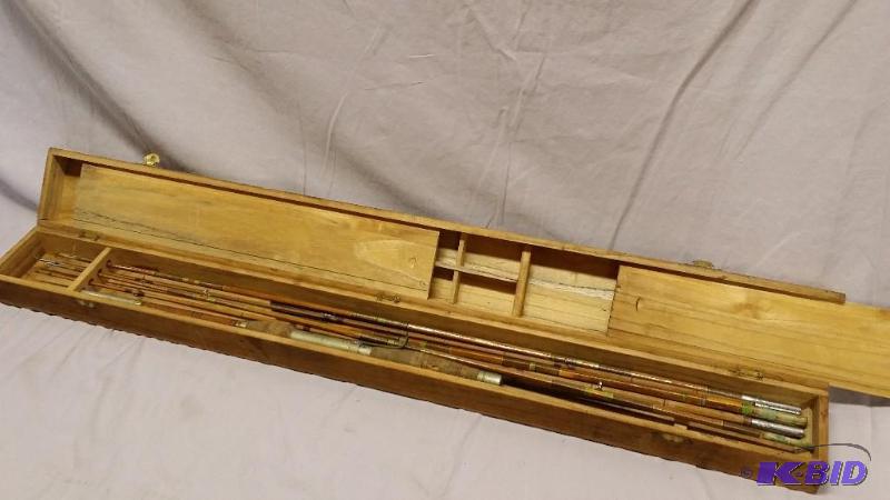 Vintage fishing pole in wooden case. Label re...