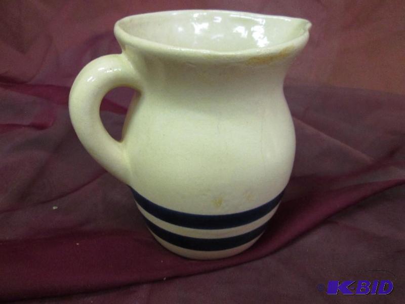 lot 145 image: Roseville 303-G pitcher with blue stripe...