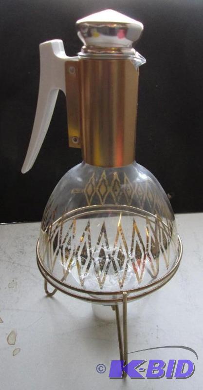 lot 18 image: Glass pitcher with cork top lid, on a stand w...