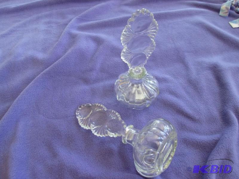 lot 230 image: Pair of bottles with tall glass stoppers...