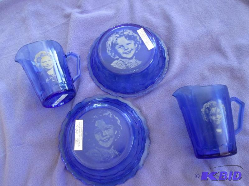 lot 231 image: Shirley Temple bowls and mugs in blue glass...