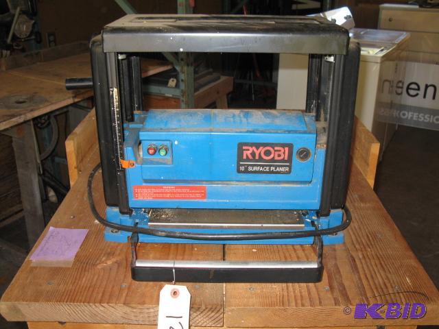 lot 51 image: Ryobi 10 inch planer with stand, with extra c...